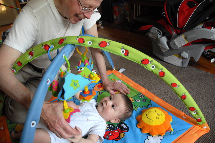 with grandpa on playmat