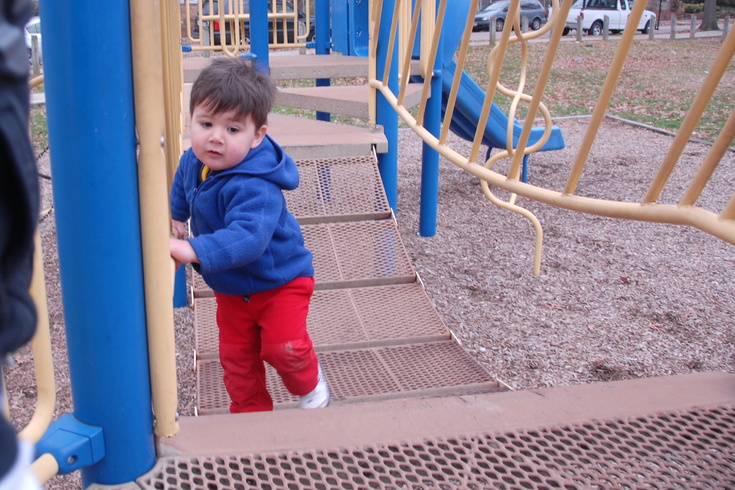 climbing up the playground bridge