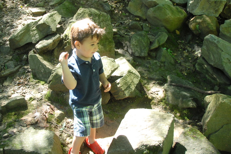 tossing rocks into the creek