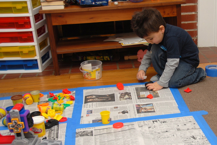 keep the play doh on the newspapers