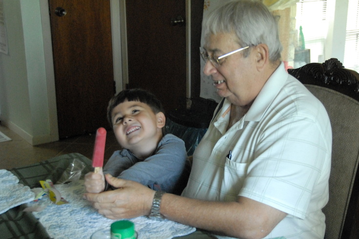 sharing popsicle with Grandpa