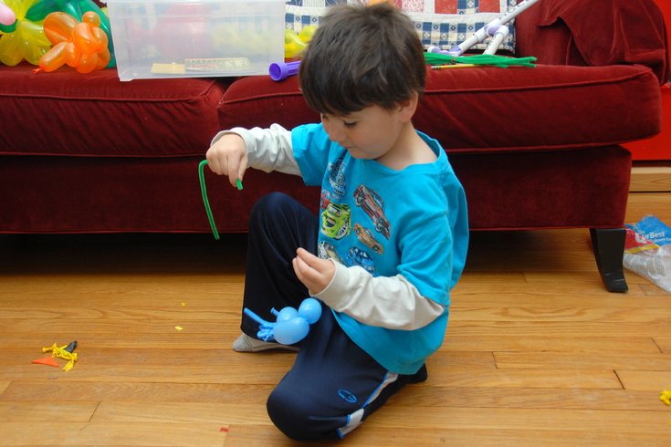Popping balloons with a pipe cleaner