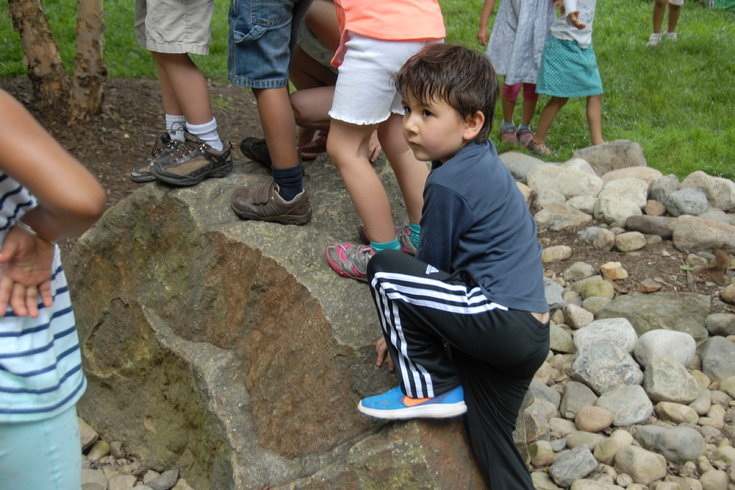 climbing a boulder