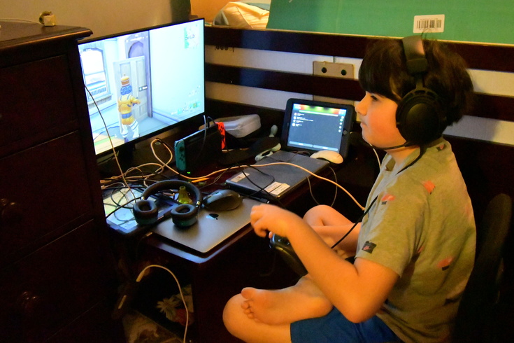gaming with his new monitor