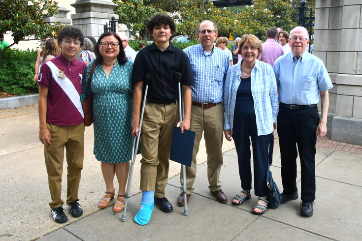 family celebrates 8th grade promotion